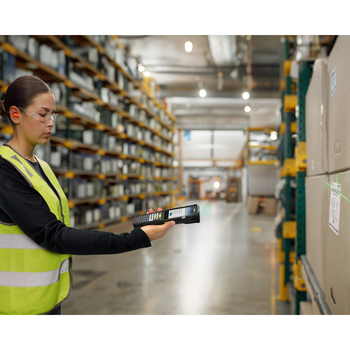 Zebra MC3450 rugged 5G keypad mobile computer, straight shooter, 29-key numeric keypad (MC345B-3S1J52SS-A6) – in use in a warehouse