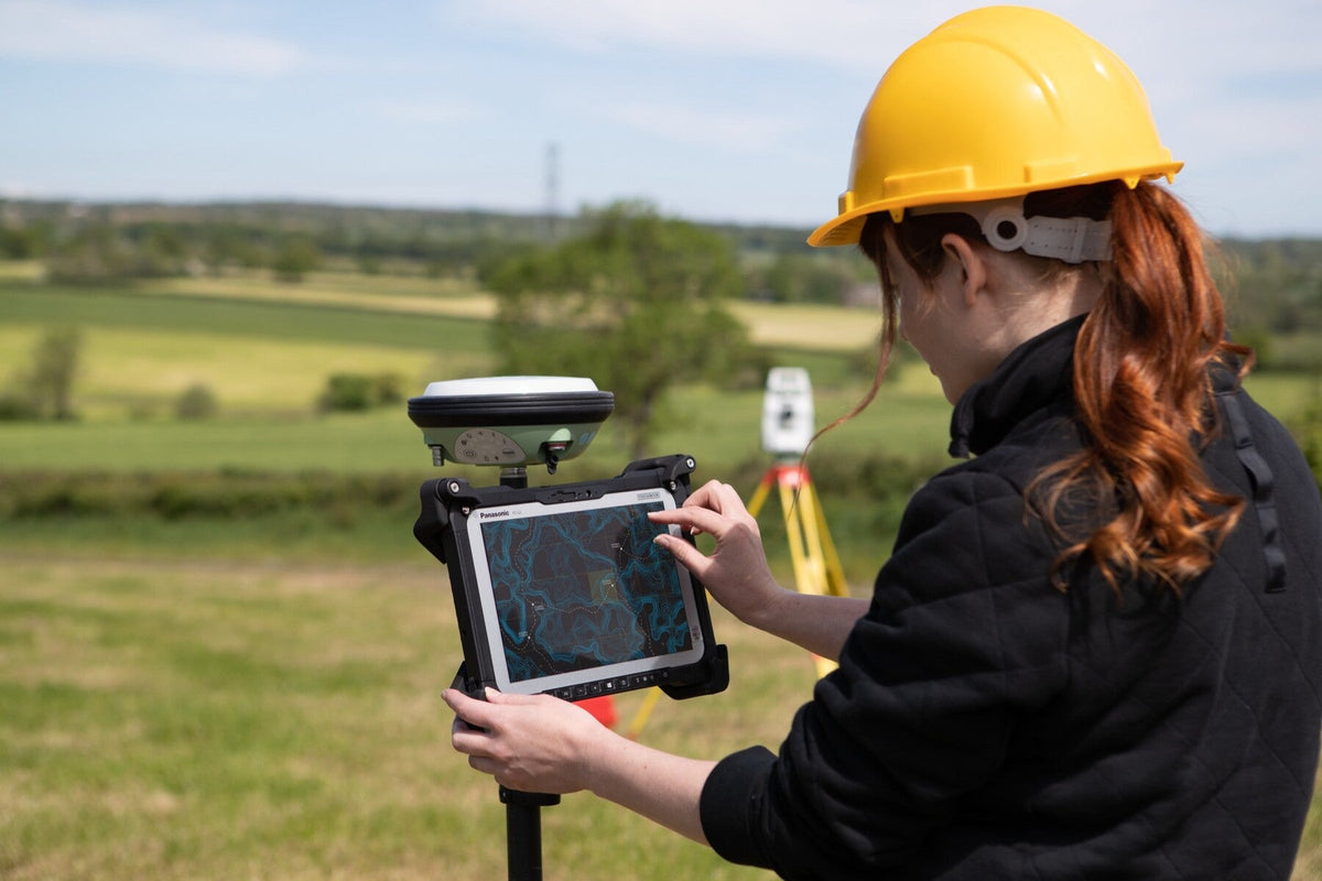 Surveyor using the Panasonic TOUGHBOOK G2 mk3 (4G LTE + GPS, UK plug) on a GNSS pole for field mapping and GIS data capture