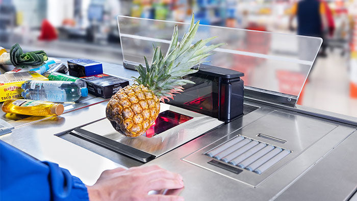Datalogic Magellan 9550i bi-optic in-counter scanner (957011001-00351) – in use at a staffed checkout